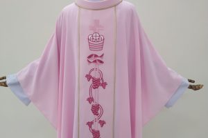 Why do priests wear rose vestments?